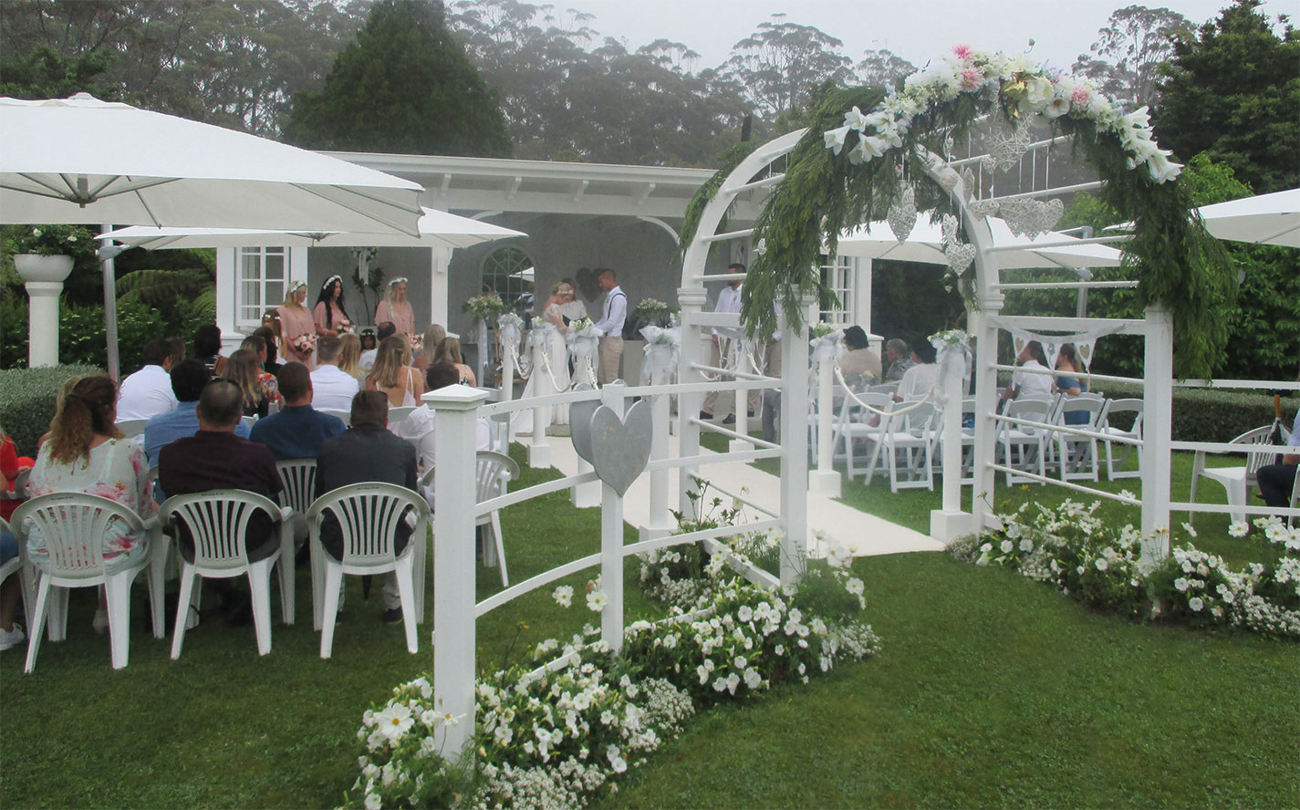 ceremony in the pavilion at seronera country garden weddings bay of islands